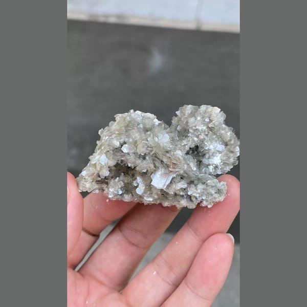 Glittering silvery mica flower cluster from Xuebaoding, Sichuan — alternate view