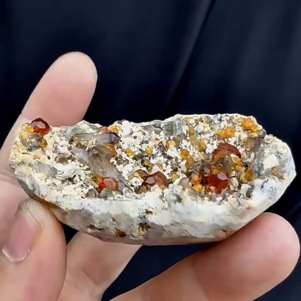 Complete side profile of garnet smoky quartz feldspar and mica