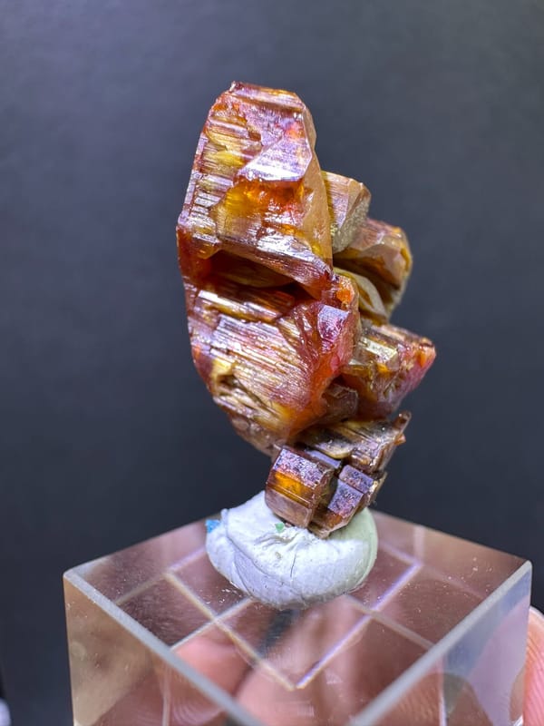 Left oblique view of the amber and red-brown vanadinite growth