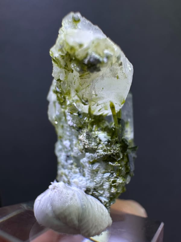 Side view showing green epidote through the clear quartz body