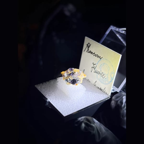 Phantom fluorite with iridescent quartz from Yindu in a specimen box — alternate view