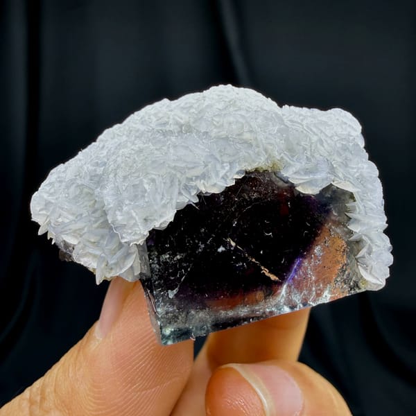 Complete front source-photo view of purple phantom fluorite with calcite