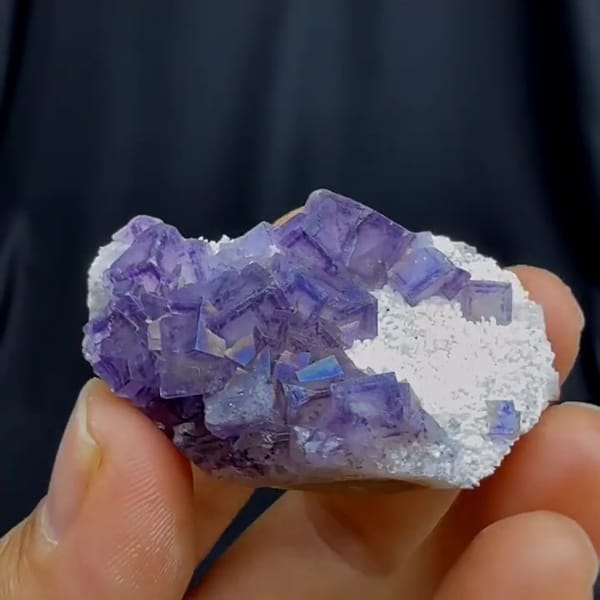 Complete reverse source-video view of the exact fluorite specimen