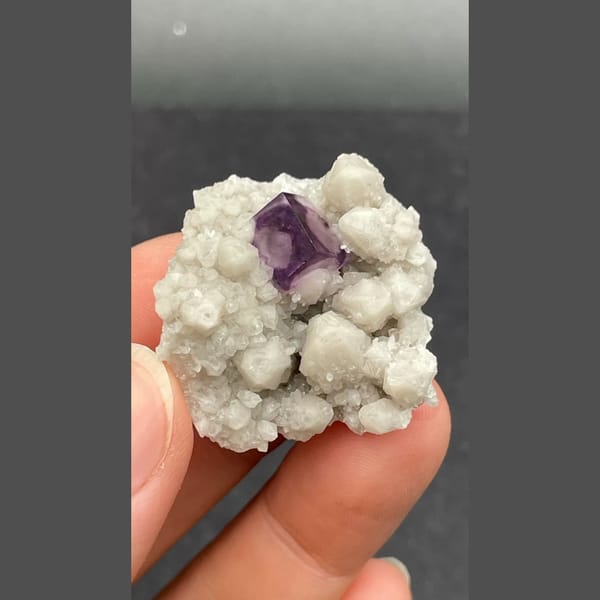 Purple fluorite nested in white quartz from Inner Mongolia — detail view