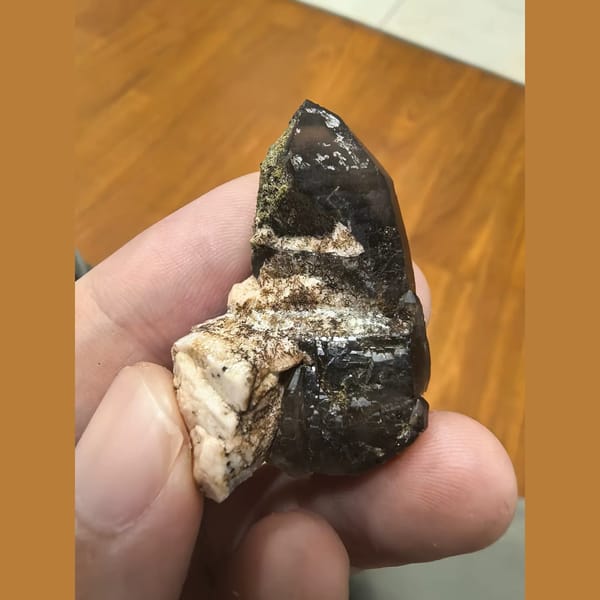 Smoky quartz point with green epidote and feldspar — complete view
