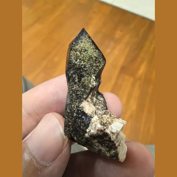 Smoky quartz point with green epidote and feldspar — alternate view