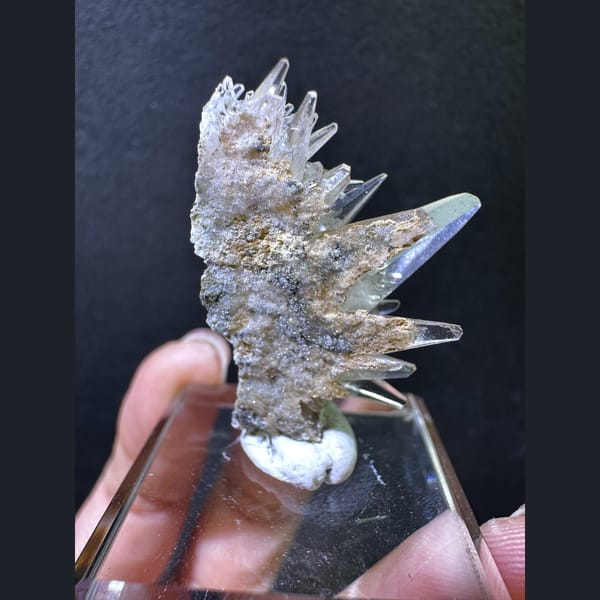 Spiky dogtooth calcite on green matrix from Pakistan — detail view