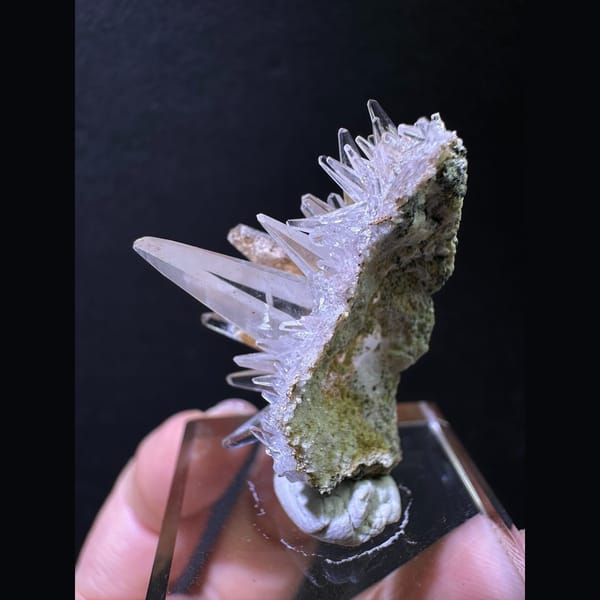 Spiky dogtooth calcite on green matrix from Pakistan — detail view