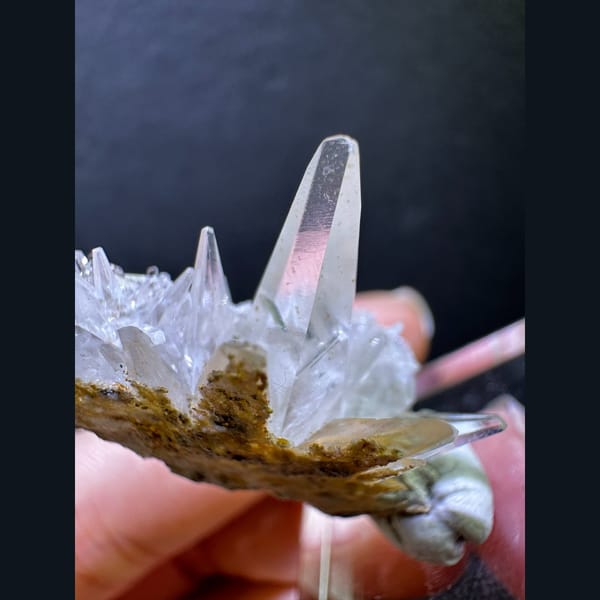 Spiky dogtooth calcite on green matrix from Pakistan — detail view