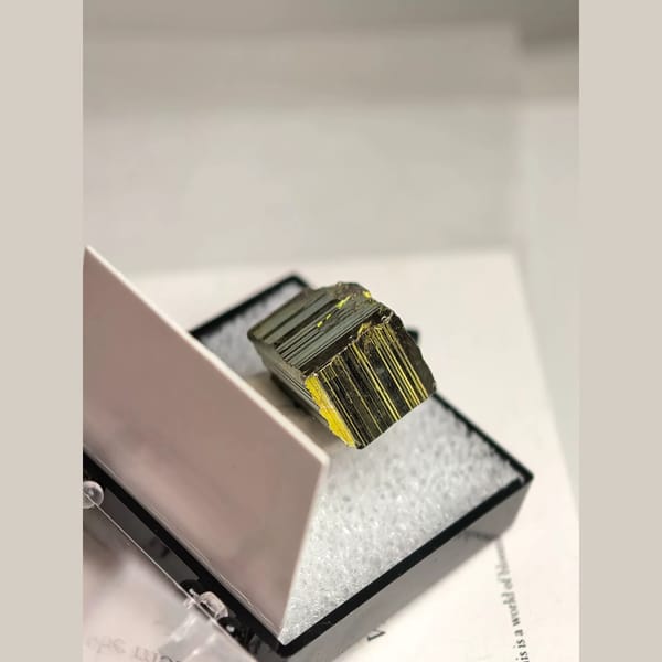Iridescent striated pyrite cube from Peru — complete view