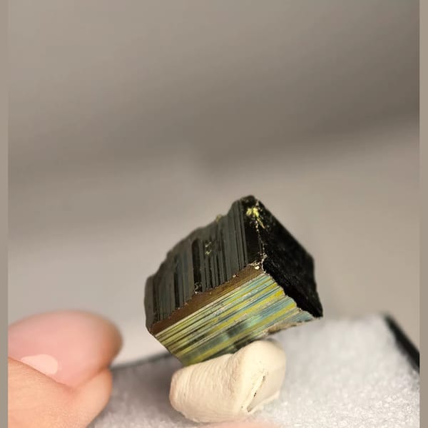 Iridescent striated pyrite cube from Peru — alternate view