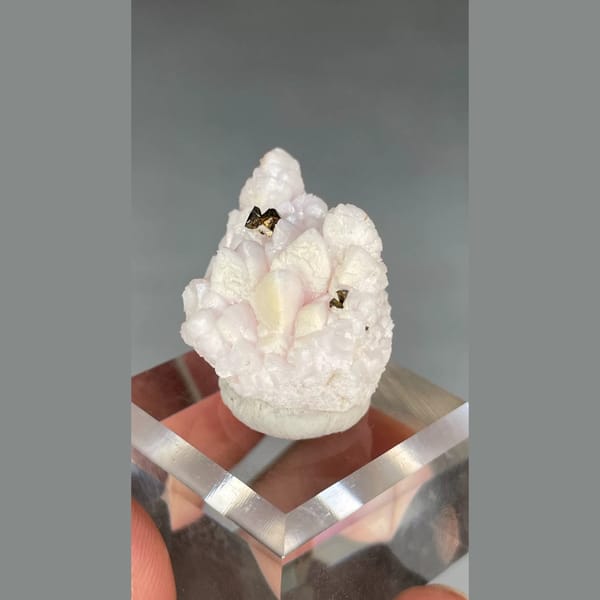 Pale pink manganoan calcite with chalcopyrite from Bulgaria — detail view