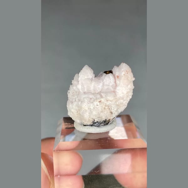 Pale pink manganoan calcite with chalcopyrite from Bulgaria — detail view
