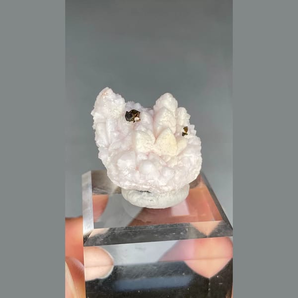 Pale pink manganoan calcite with chalcopyrite from Bulgaria — detail view
