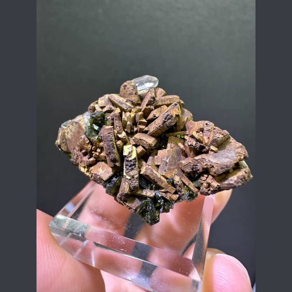 Bronze epidote crystal cluster with small quartz point from Sichuan — alternate view