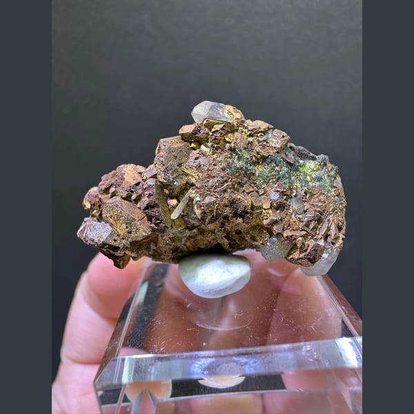 Bronze epidote crystal cluster with small quartz point from Sichuan — alternate view