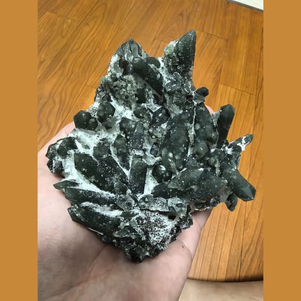 Palm-sized green quartz cluster — complete view