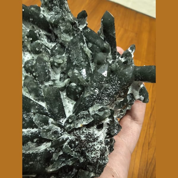 Palm-sized green quartz cluster — detail view
