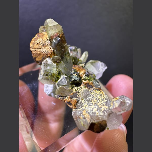 Clear quartz with olive epidote from Sichuan — detail view