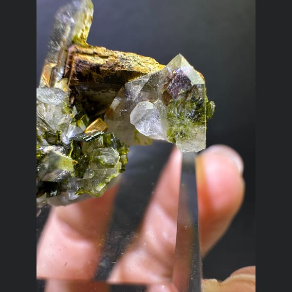 Clear quartz with olive epidote from Sichuan — detail view