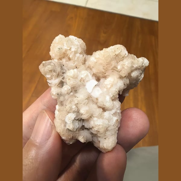 Pink floater calcite flower cluster — complete view