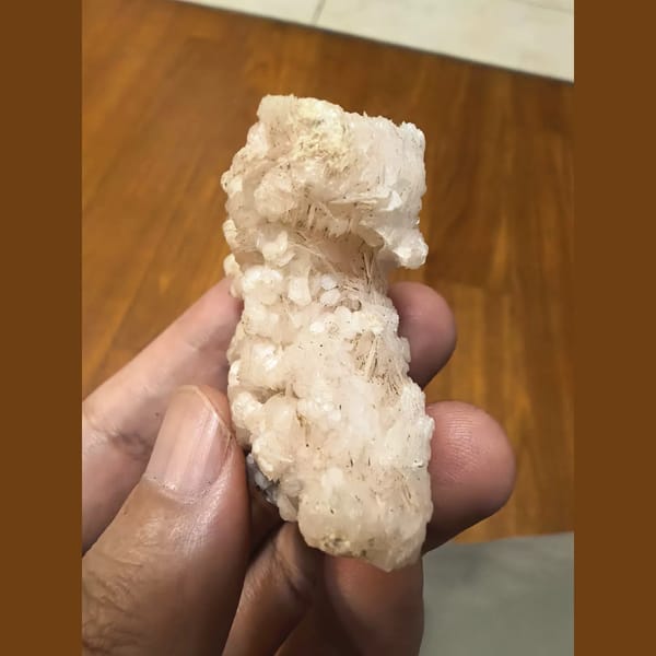 Pink floater calcite flower cluster — detail view