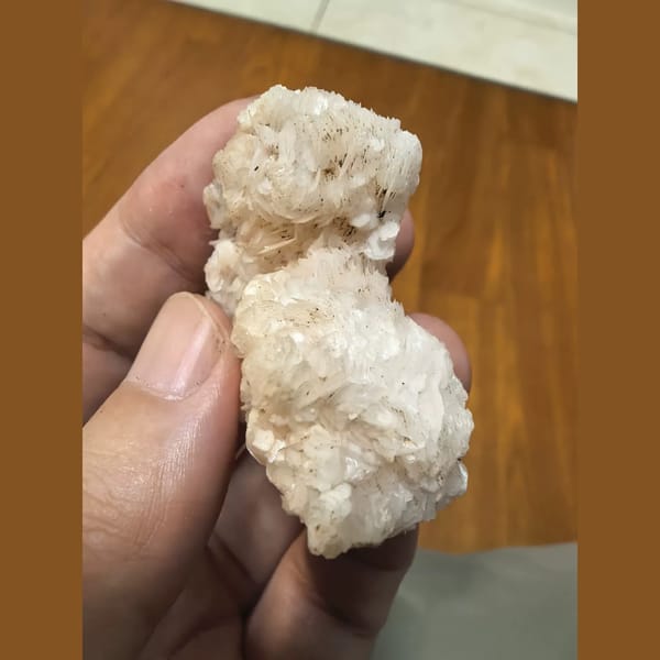 Pink floater calcite flower cluster — detail view