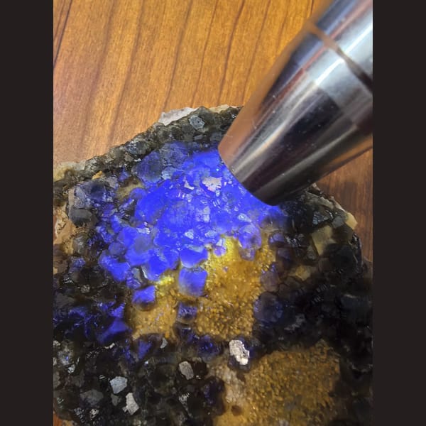Large blue-green fluorite on calcite matrix — detail view