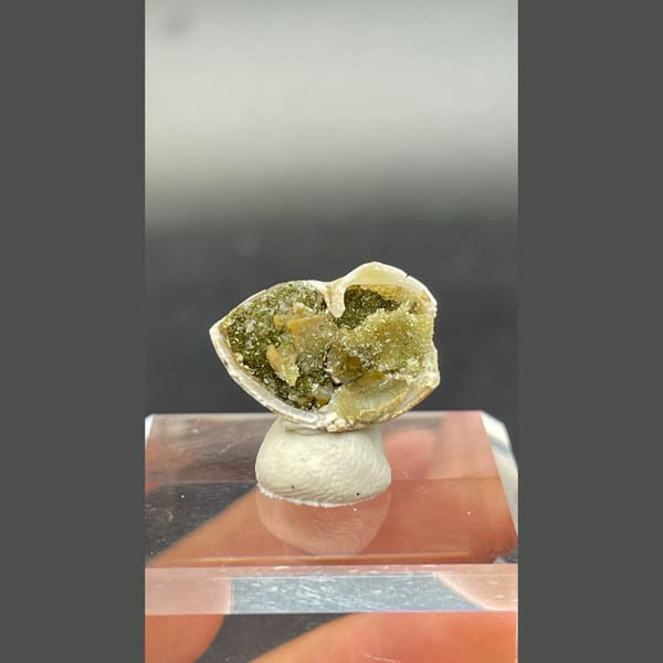 Small olive-green anapaite crystal ball from Yunnan — complete view