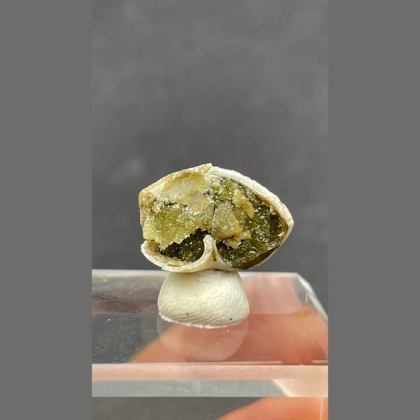 Small olive-green anapaite crystal ball from Yunnan — detail view