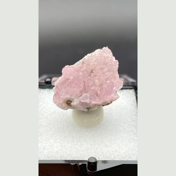 Pale pink sparkling cobaltoan calcite crust from Morocco — detail view