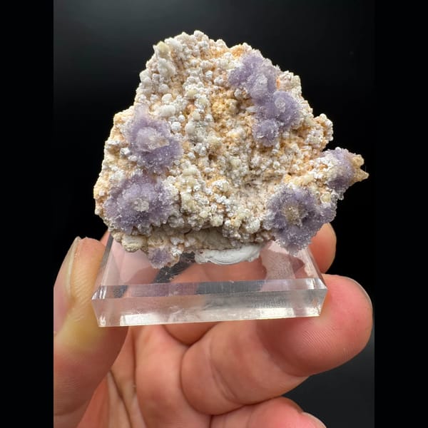 Purple creedite flower clusters on matrix from Guizhou — alternate view