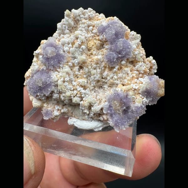 Purple creedite flower clusters on matrix from Guizhou — alternate view