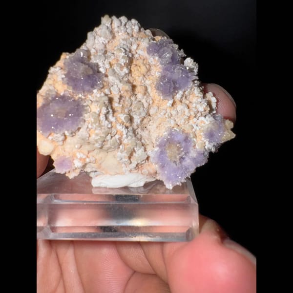 Purple creedite flower clusters on matrix from Guizhou — detail view