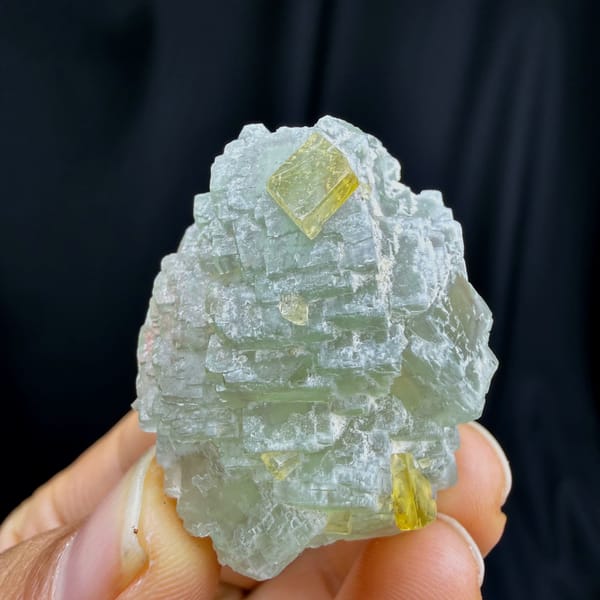 Complete upright profile of stepped green fluorite with barite