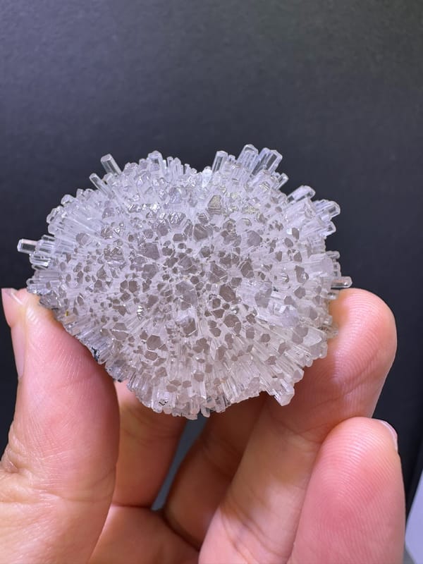 Crystal-covered face of the exact white zeolite flower cluster
