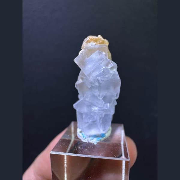 Pale blue fluorite column with tan calcite from Yunnan — complete view