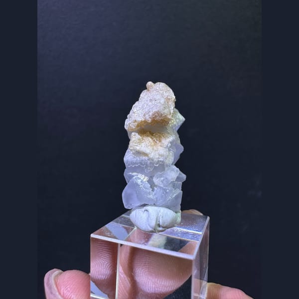 Pale blue fluorite column with tan calcite from Yunnan — detail view