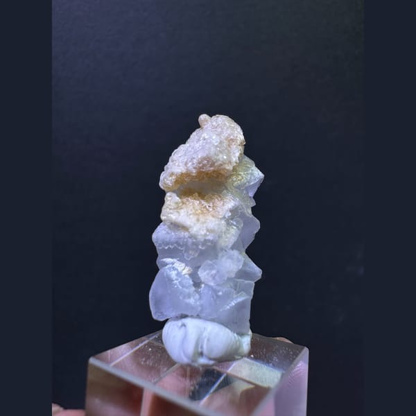Pale blue fluorite column with tan calcite from Yunnan — detail view
