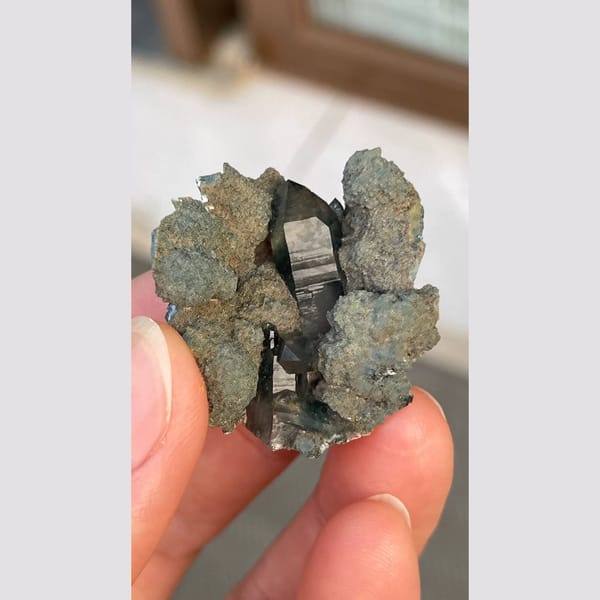 Dark blue-grey ghost quartz cluster from Namibia — complete view