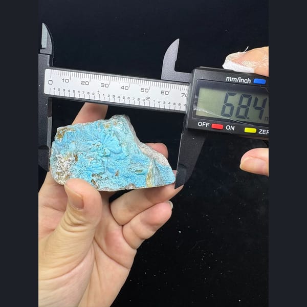 Sky blue fluorescent gibbsite with gearksutite from Qinglong — alternate view