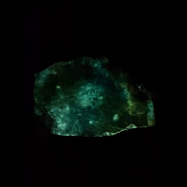 Sky blue fluorescent gibbsite with gearksutite from Qinglong — detail view