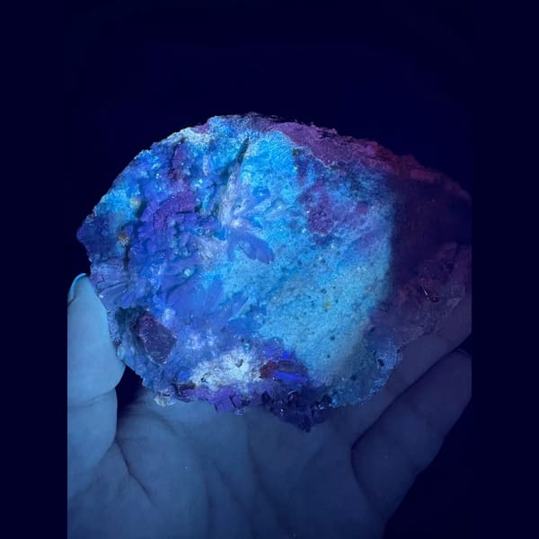 Large sky-blue fluorescent gibbsite from Qinglong — alternate view