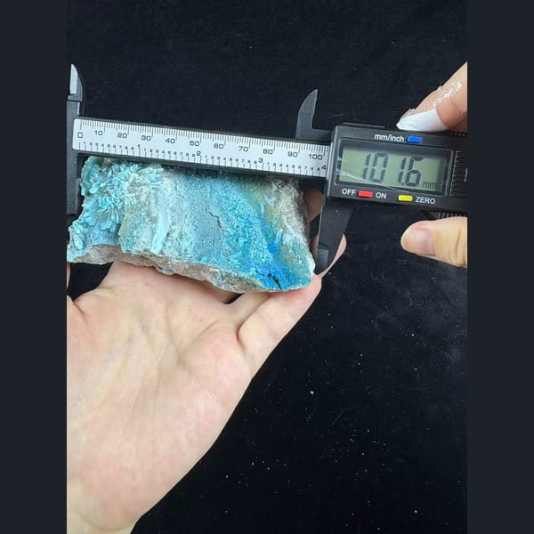 Large fluorescent gibbsite with gearksutite from Qinglong — alternate view