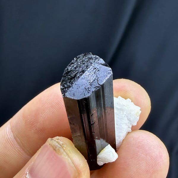 Complete upper face and feldspar view of the black tourmaline specimen