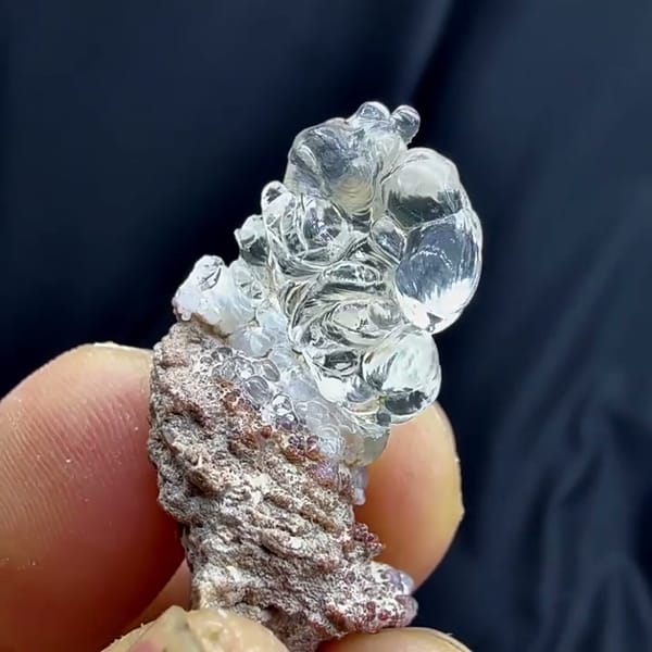 Complete side view of the exact Mexican hyalite opal specimen