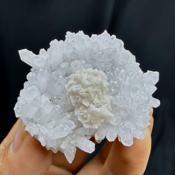 Complete side profile of radiating quartz with rounded dolomite