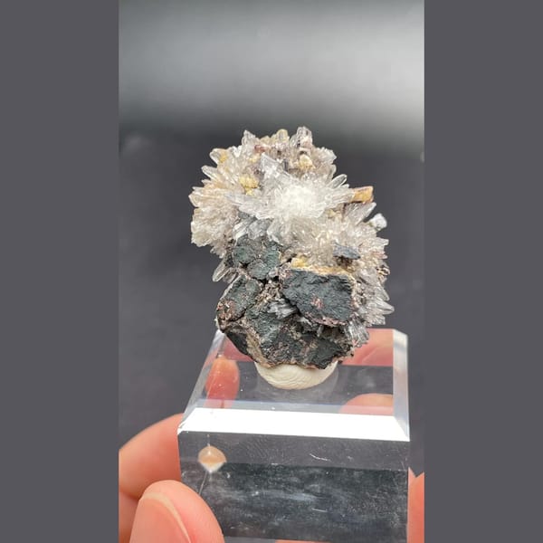 Gearksutite flower on matrix from Guizhou — detail view
