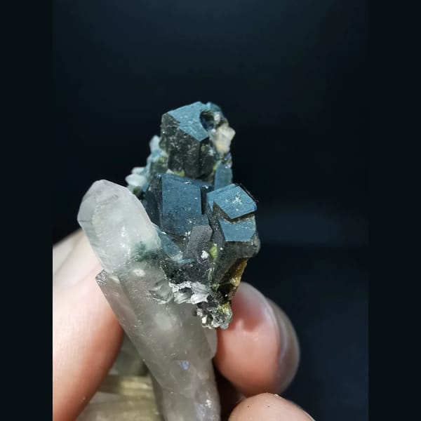 Quartz cluster with black garnet — alternate view