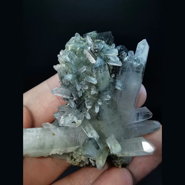 Quartz cluster with black garnet — alternate view